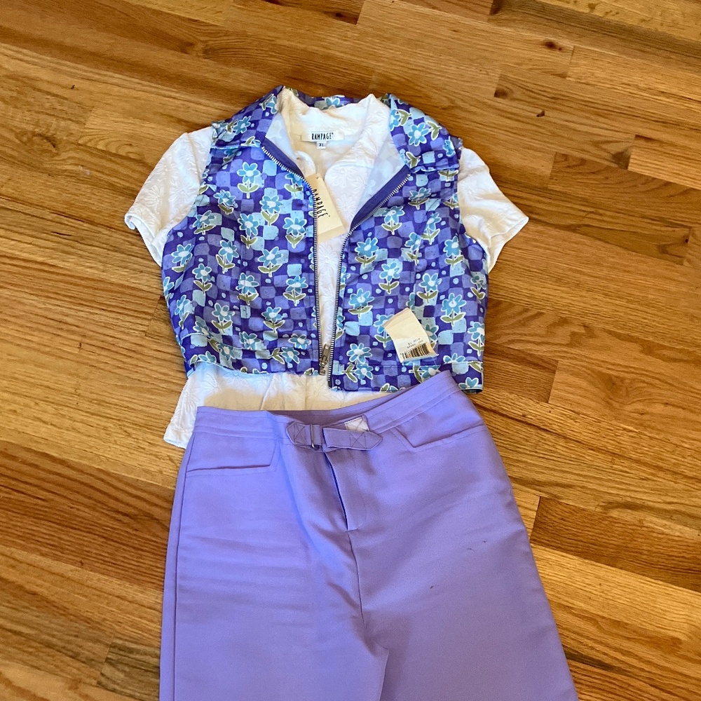 Three-piece outfit. Shirt, vest, and lilac pants.